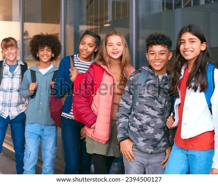 Portrait Showing Class Of Secondary Or High School Pupils Standing Outside School Building Royalty-Free Stock Photo #2394500127