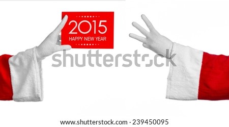 Christmas and New Year theme: Santa's hand holding a red card with New Year Greetings 2015 on a white background isolated