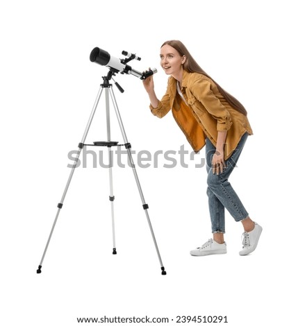 Young astronomer looking at stars through telescope on white background Royalty-Free Stock Photo #2394510291