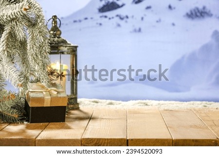 Wooden retro board of free space for your decoration and pedestal. Landscape of mountains and cold december time. Mockup background and snow with frost decoration. 