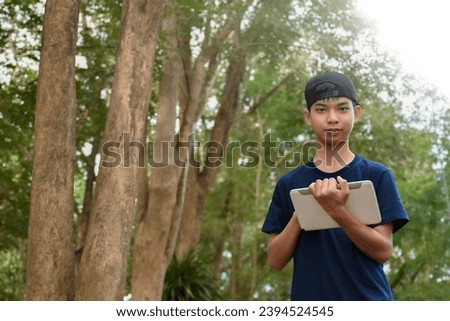 Asian boy learning natures, trees, plants, insects, leaves and creatures at botanical garden, new edited.
