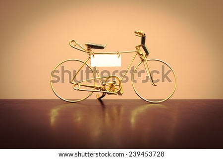 Toy model of the bike, made of gold wire