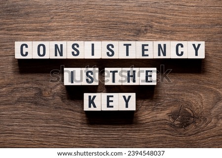 Consistency is the key - word concept on building blocks, text, letters