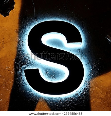 Cool S alphabet with silhouette effect.