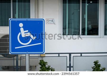 Sign indicating ramps for wheelchairs.