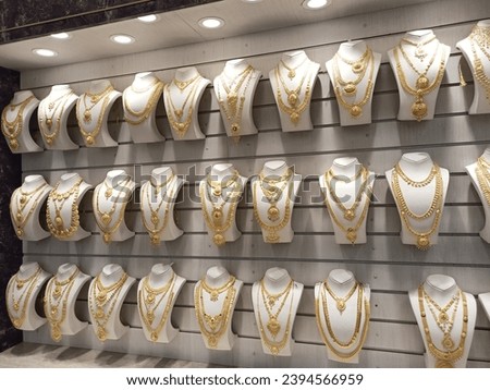 A picture of various gold jewellery in display in a Jewellery shop in India