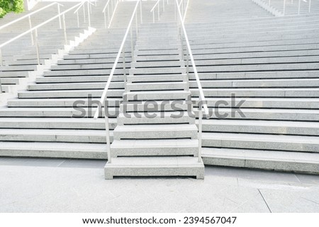 Modern Empty Long stair concrete in office building,Stairs from underground upward,Horizontal view of stairs in airport.