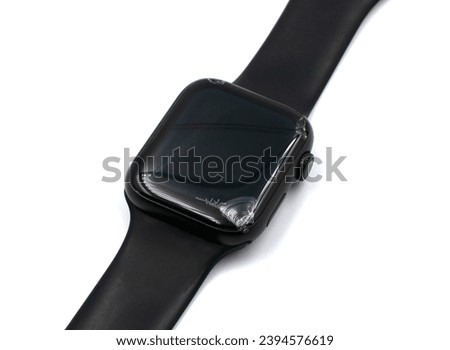 Smart watch with a broken screen, close-up on a white background.