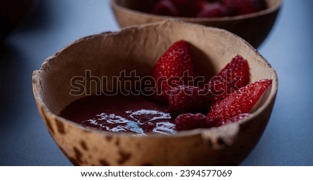 Strawberries and raspberries in guava sauce