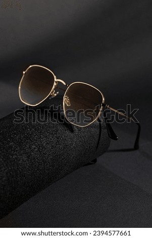 Trendy sunglasses background. Fashion summer accessories. Copy space for text. Black gold concept. Optic store discount poster