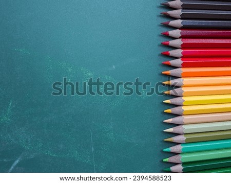 Color pencils on chalkboard background