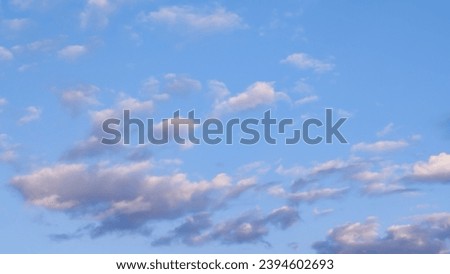 The sky at sunset is cloudy. Beautiful photo of heaven in high quality. Stock image of clouds.