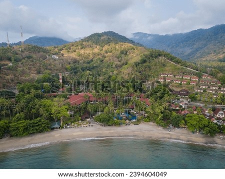 Aerial view of Senggigi resort coastline in Lombok Island, West Nusa Tenggara, Indonesia. Resort island in east from Bali island