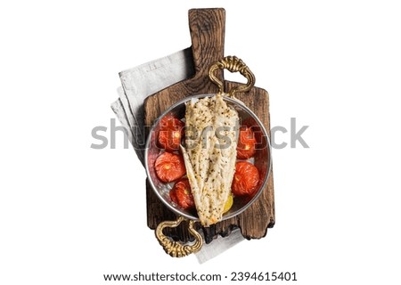 Roasted Haddock fish fillet in skillet with tomato and potato. Isolated, white background