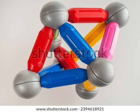 Magnetic constructor for children for the development of motor skills, details of constructors isolated on a white background