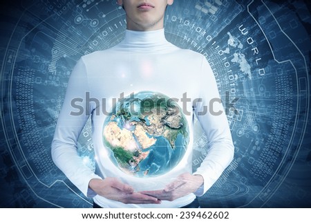 Young man holding digital Earth planet in hands. Elements of this image are furnished by NASA