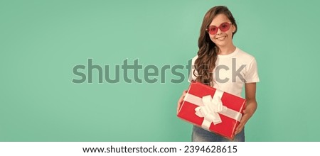 surprise for her. boxing day. cheerful kid with present box. teen girl giving birthday gift. Child with birthday gift, horizontal poster. Banner header with copy space.
