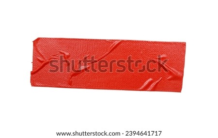 A piece of general purpose vinyl red tape isolated on white  Royalty-Free Stock Photo #2394641717