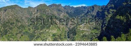 panoramic view of the mountains adjacent to Pico do Areeiro on a blue sky day on the island of Madeira.