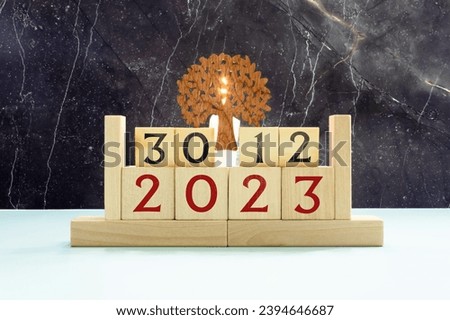 December 30 vintage wooden block calendar bokeh lights background.