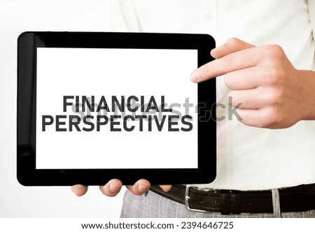 Text Financial Perspectives on tablet display in businessman hands on the white background. Business concept