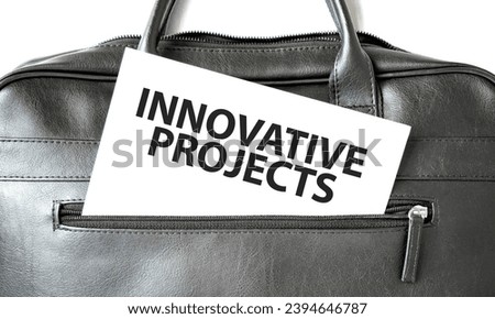 Text Innovative Projects writing on white paper sheet in the black business bag. Business concept