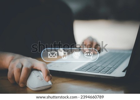 Businessman using computer keyboard with the email, call phone, address, Chat message icons.Customer support hotline Contact us people connection.