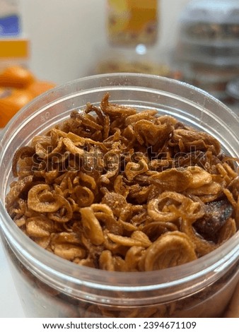 a picture of fried onions in a jar