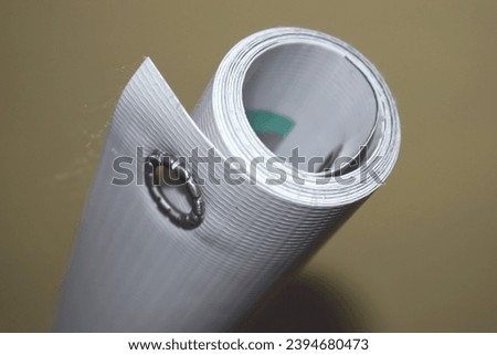 Rolled banner or billboard with a grammatical thickness of 560 grams, backlite with perporation or holes in the corners of the eyelets for hanging or rope ties to prevent tearing 