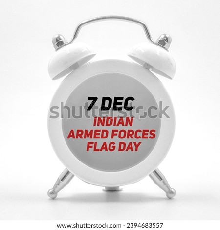 7 December indian armed forces flag day inscribed over clock  Royalty-Free Stock Photo #2394683557