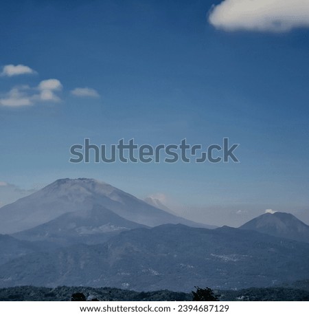 a clear view of Mount Merbabu, Mount Telomoyo and Mount Tidar, in Central Java Province, Indonesia. Royalty-Free Stock Photo #2394687129