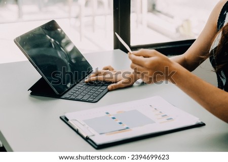 Close up woman hand using credit card and smartphone laptop for buying online shopping