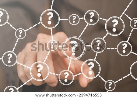 Businessman touching a question icon on a virtual screen on a cloud network background. Question mark. FAQ, support, questions and answers. Business concept, help service, QA Royalty-Free Stock Photo #2394716553