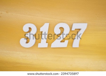 The golden yellow painted wood panel for the background, number 3127, is made from white painted wood.