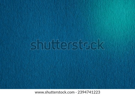 Textured background of blue paper close-up, macro photography detailed paper uneven texture. Blank copy space