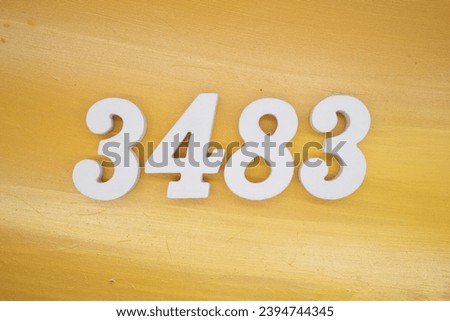 The golden yellow painted wood panel for the background, number 3483, is made from white painted wood.