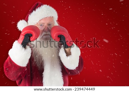 Santa Claus is ready to fight against red background