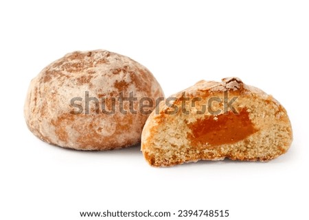 Gingerbread with filling on a white background. Half a gingerbread cake with jam. Royalty-Free Stock Photo #2394748515