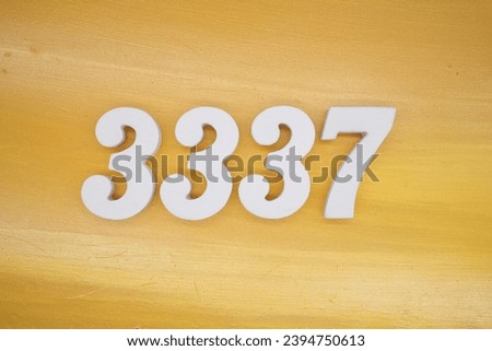 The golden yellow painted wood panel for the background, number 3337, is made from white painted wood.