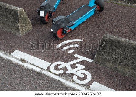 Electric scooter e-scooter road sign floor paint eco friendly mobility city transport