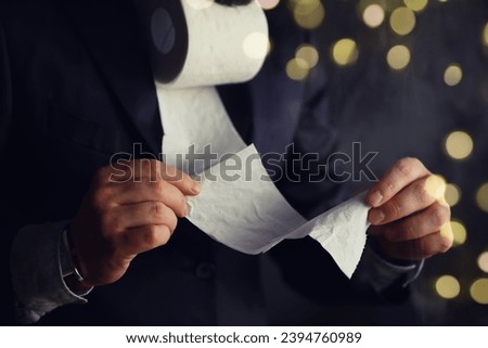 Rich Businessman paying in Toilet Paper, copy space. Toilet papers is the new currency concept