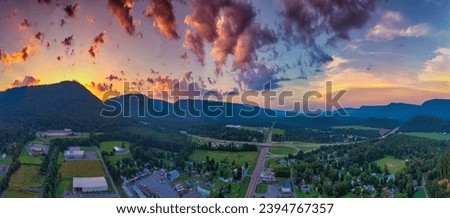 A view of Dayton, Tennessee at sunset with the mountains in the background. Royalty-Free Stock Photo #2394767357