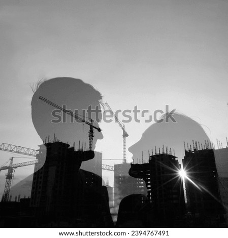 silhouette of young couple standing face to face on building tall unfinished house, construction crane background. double exposure. sun rays. idea, concept of mortgage, hypothecation,  hypothec