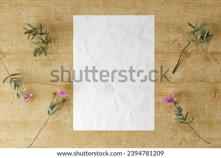 Poster mockup rustic wooden with plants textured paper