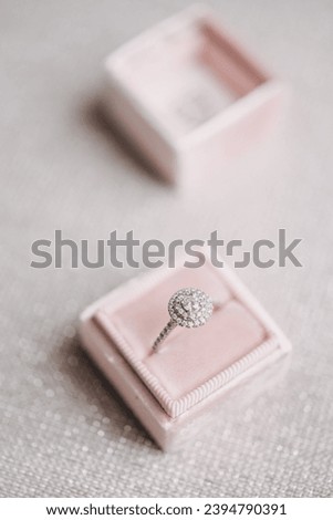 Engagement ring in a pink box