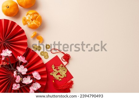 Chinese New Year prosperity theme. Top view decorative fans, symbolic coins, dragon wall hanging, red envelopes, tangerines arranged on neutral backdrop, creating auspicious ambiance with text space