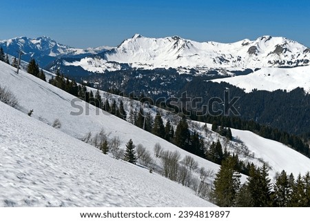 Snowy mountains in the UNESCO Geopark Chablais, Les Gets, Haute-Savoie, France Royalty-Free Stock Photo #2394819897