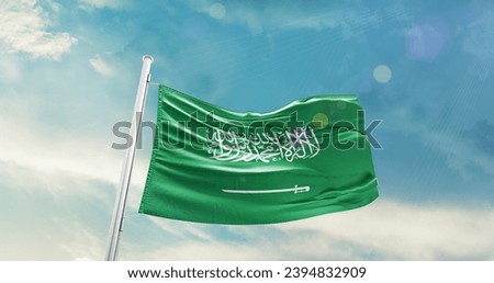 Saudi Arabia national flag waving in beautiful sky.