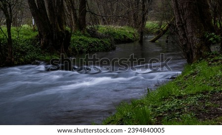 River flowing down a smal step, slow-shutter speed