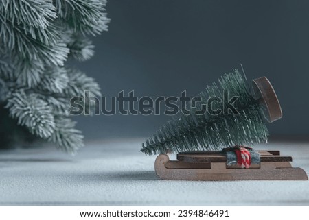 a sleigh with christmas tree in the snow. christmas, new year background, with copy space
